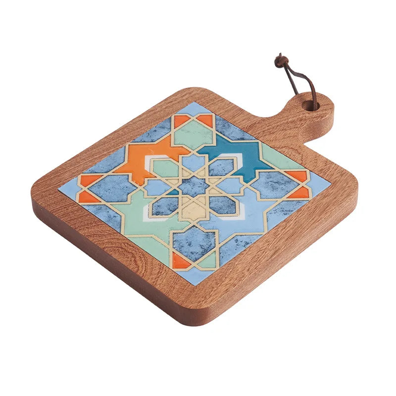 Wooden cutting board with a colorful geometric pattern on a white background