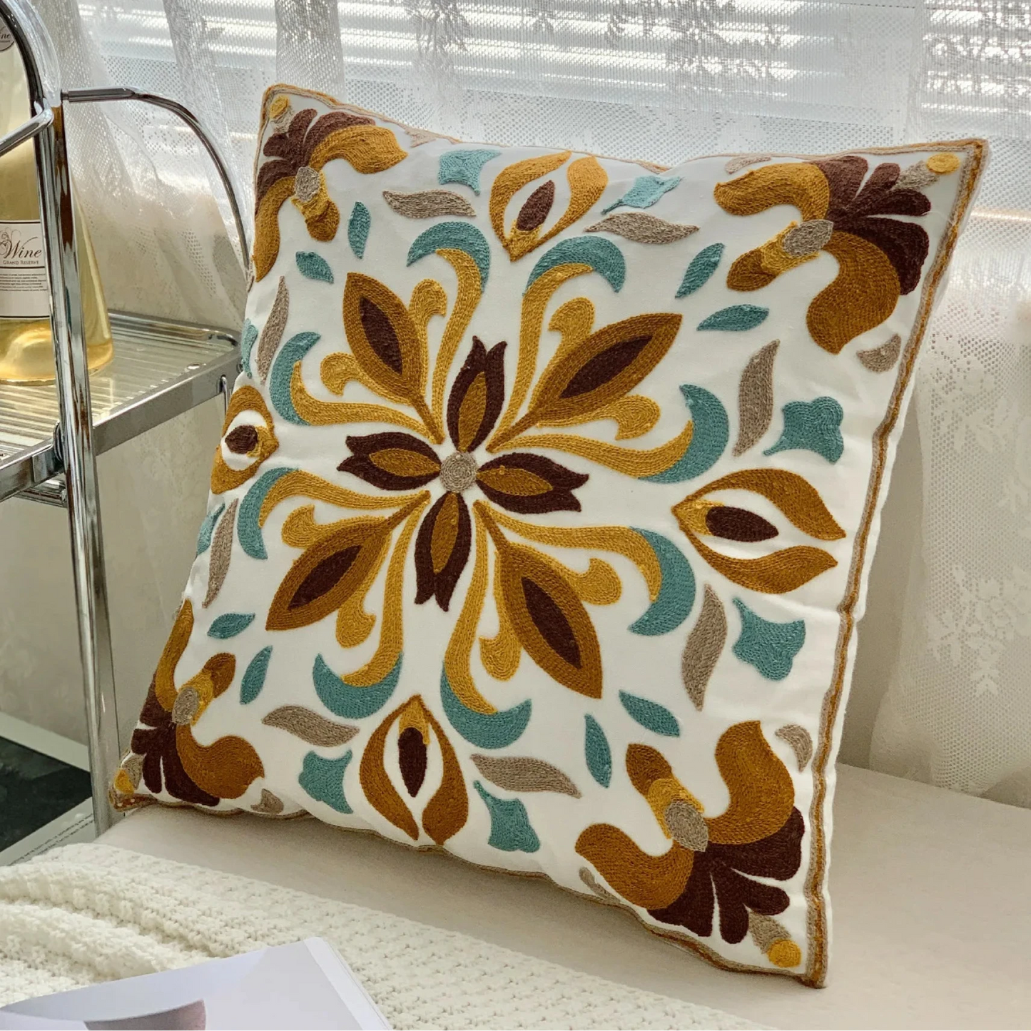 Decorative pillow with floral pattern on a couch, floral embroidery on linen cotton cushion cover – boho home decor accent