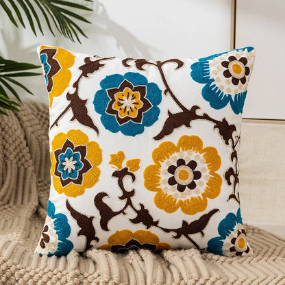Vintage floral embroidered pillowcase styled on a sofa, boho throw cushion cover adds texture and charm to bohemian home decor, perfect for cozy living room decor, eclectic home styling, and unique boho gifts under $50