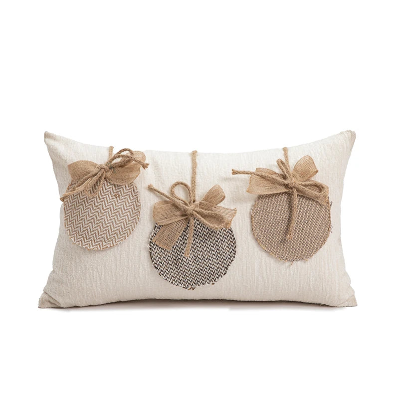 Decorative pillow with three textured ornaments on a white background
