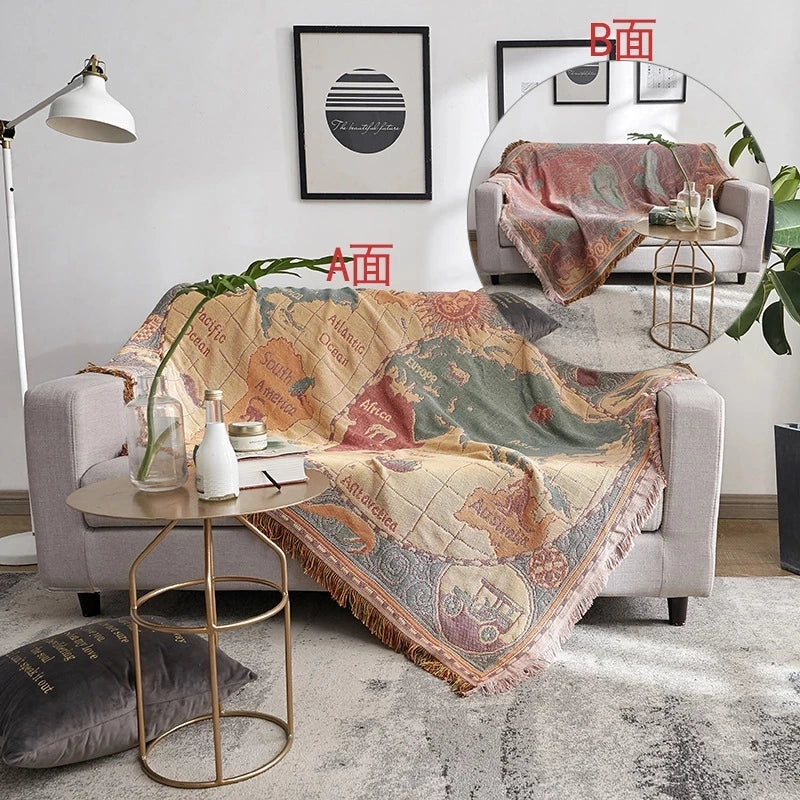 Sofa with a decorative blanket in a living room setting. Mediterranean style woven cotton throw blanket boho home decor