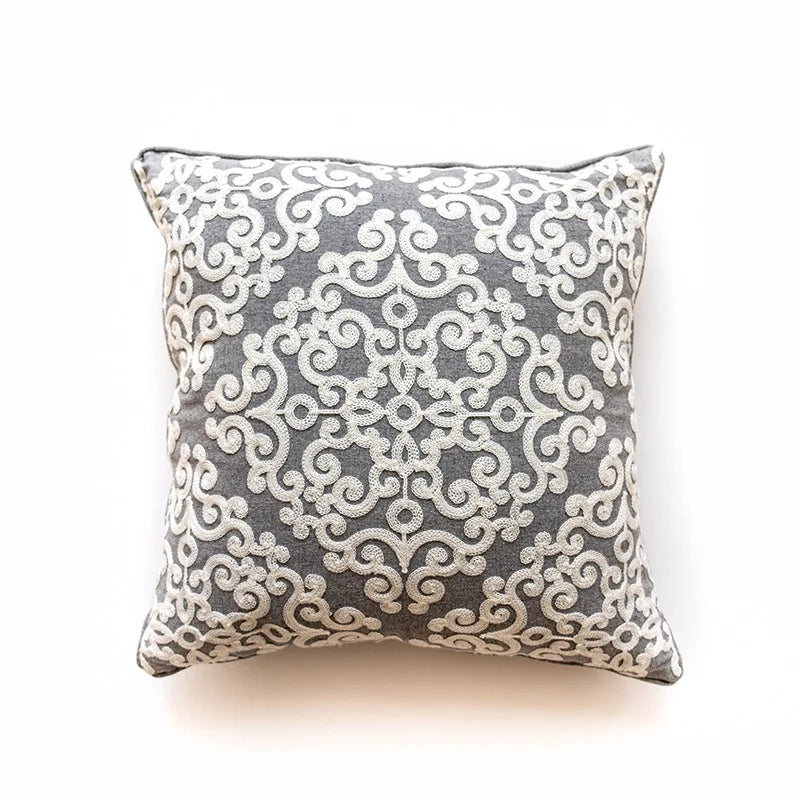 Decorative pillow with intricate pattern on a white background