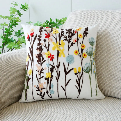 Decorative pillow with floral pattern on a beige couch. Floral embroidered throw pillow cover boho decor