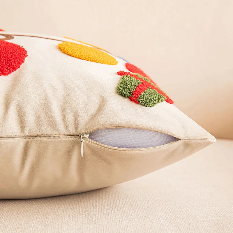 Decorative pillow with colorful abstract patterns on a beige background