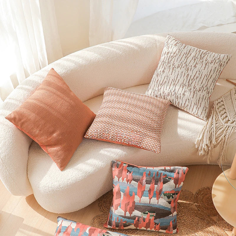 Decorative pillows on a beige sofa with a neutral background. Modern yarn-dyed throw pillow cover, luxury textured decorative cushion for sofa, bed, or window seating in soft neutral tones.