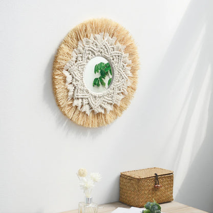 Round decorative mirror with macrame design on a white wall, with a small plant and basket in the foreground. boho home decor, boho wall mirror, macrame wall mirror, nordic decor, romantic wedding wall decoration, housewarming gift, round straw mirror, woven wall decor, tapestry mirror, boho bedroom wall accent, rustic mirror wall hanging