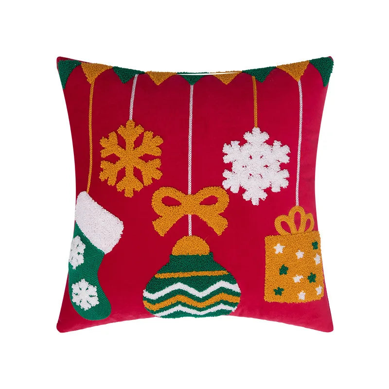 Decorative pillow with Christmas-themed patterns on a red background