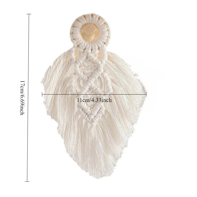 White macrame wall hanging with measurements on a white background