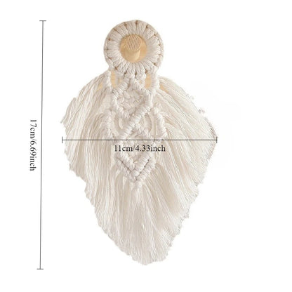 White macrame wall hanging with measurements on a white background