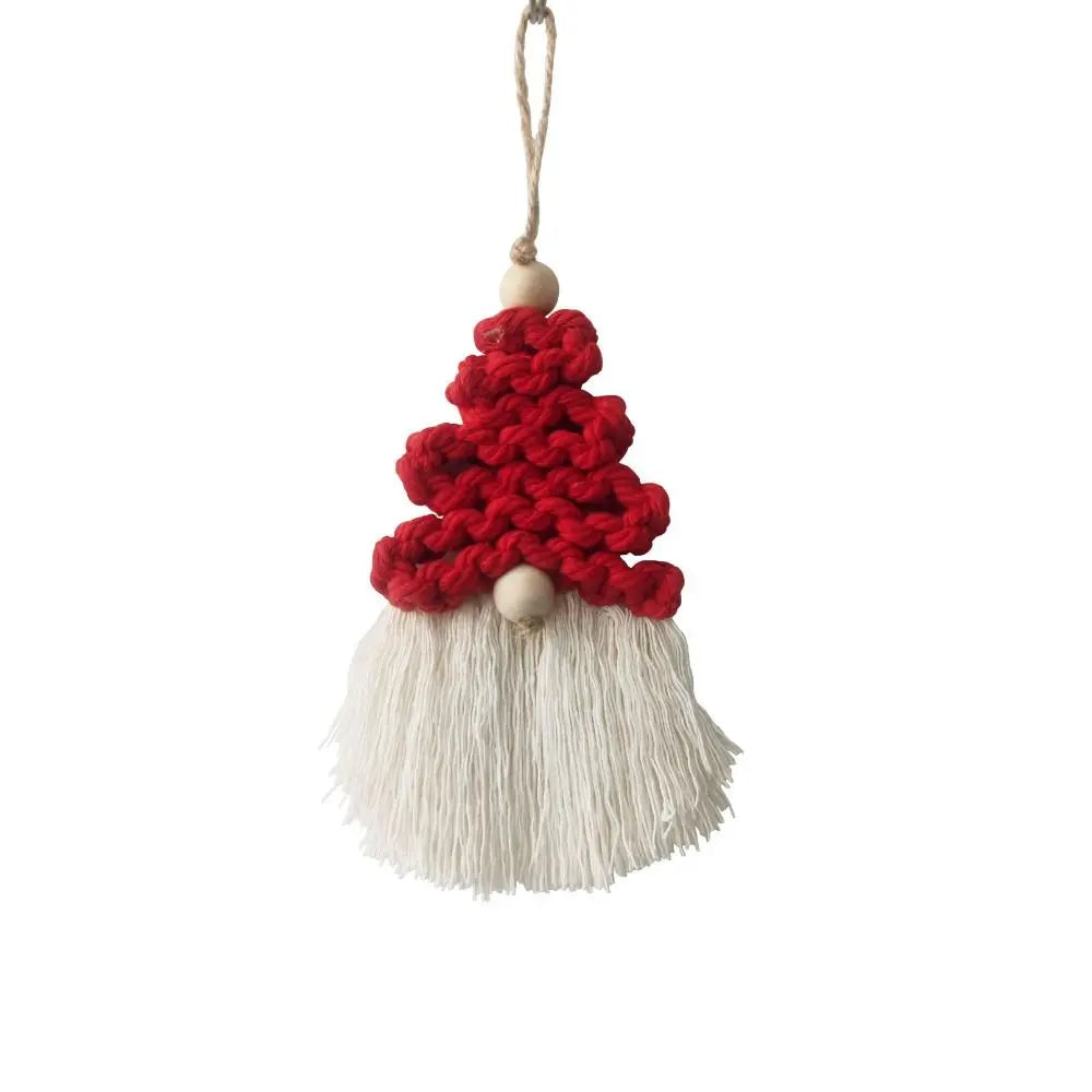 Decorative macrame gnome ornament with red hat and white beard on a white background