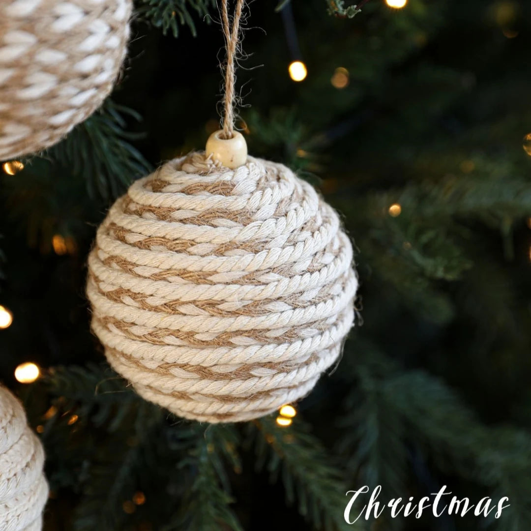 Textured Christmas ornament hanging on a tree with 'Christmas' text.