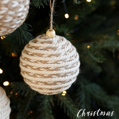 Textured Christmas ornament hanging on a tree with 'Christmas' text.