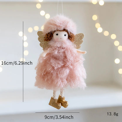 Pink fairy doll Christmas Ornament with gold wings and boots on a white background with string lights.