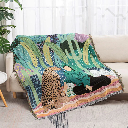 Colorful blanket with a design of a person and a leopard on a couch. Rainforest cheetah geometric throw blanket, abstract woven tapestry for sofa or wall decor, cotton boho blanket for modern home styling.