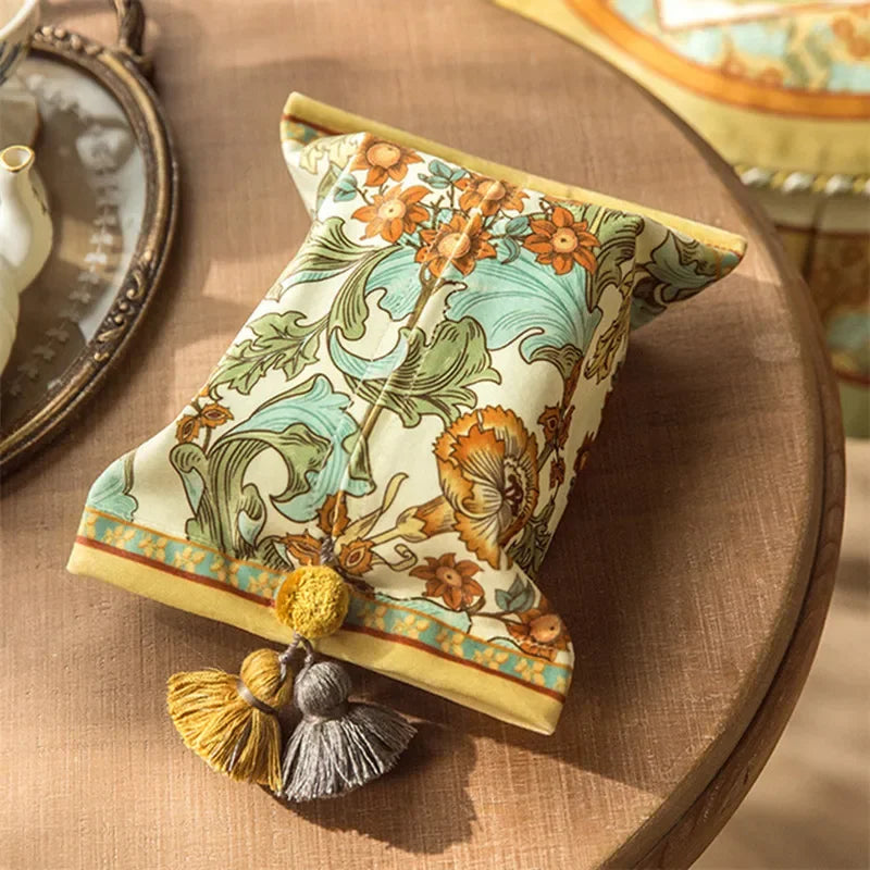 Decorative box with floral pattern and tassels on a wooden surface boho home decor, reusable tissue bag, cotton tassel tissue holder, plush tissue organizer, bathroom tissue box cover, car tissue case, American style tissue pouch, soft fabric tissue holder, decorative tissue box, housewarming gift, eco-friendly storage