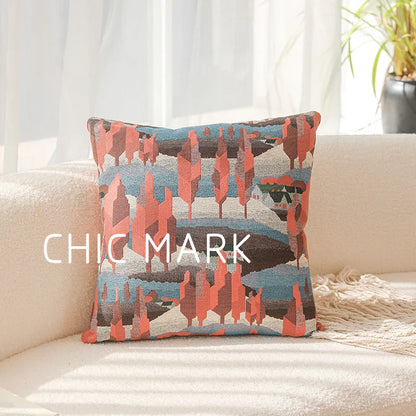 Decorative pillow with a colorful pattern on a couch, featuring the brand 'Chic Mark'.Modern yarn-dyed throw pillow cover, luxury textured decorative cushion for sofa, bed, or window seating in soft neutral tones.