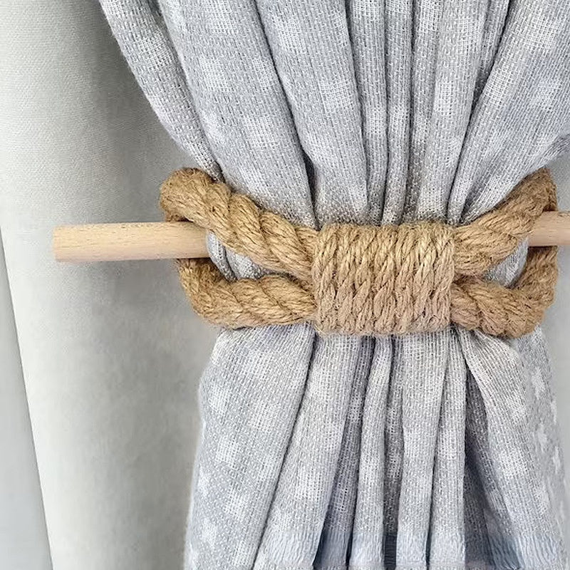 Gray curtain with a wooden rod and knotted jute tieback against a neutral background boho home decor, curtain tie back, wooden curtain buckle, nordic home accessory, hemp rope curtain tie, rustic window decor, boho curtain accessory, modern farmhouse, minimalist curtain hold, housewarming gift idea