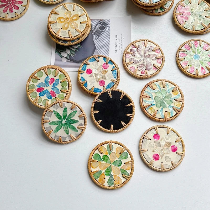Decorative boho coasters with floral patterns on a white surface