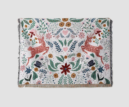 Decorative blanket with deer and floral pattern on a white background. Deer forest jacquard woven blanket with floral and woodland tapestry design – boho throw for sofa or bed, soft cotton blend decorative bedspread for cozy home décor.