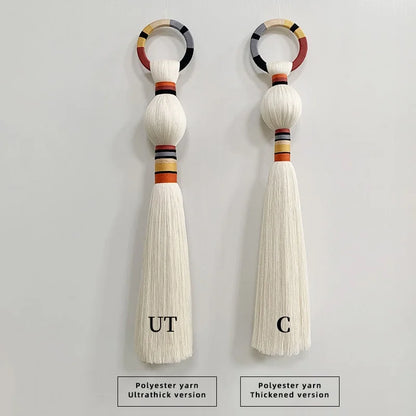 Two tassels with colorful rings on a gray background, labeled 'UT' and 'C'. boho macrame wall art