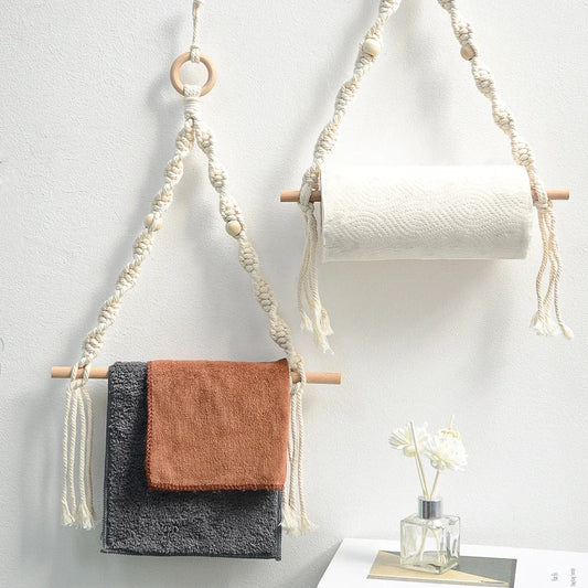 Macrame wall hanging with towels and a roll of paper towel on a white wall. boho home decor, toilet paper holder, bohemian bathroom accessory, tissue holder, wall-mounted towel rack, cotton rope toilet paper rack, wooden bead towel holder, rustic home decor, boho wall decor, bathroom organization, housewarming gift