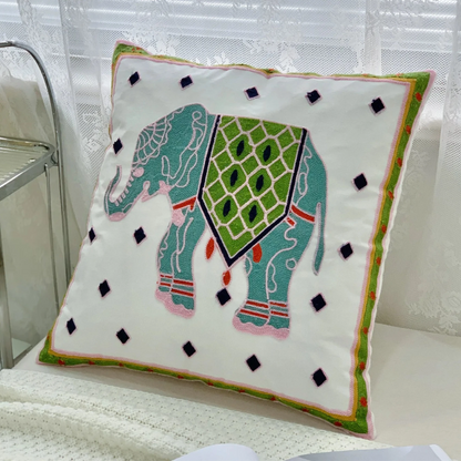 Decorative pillow with an elephant design on a chair, Handcrafted embroidered cushion cover on armchair – modern boho living room decor