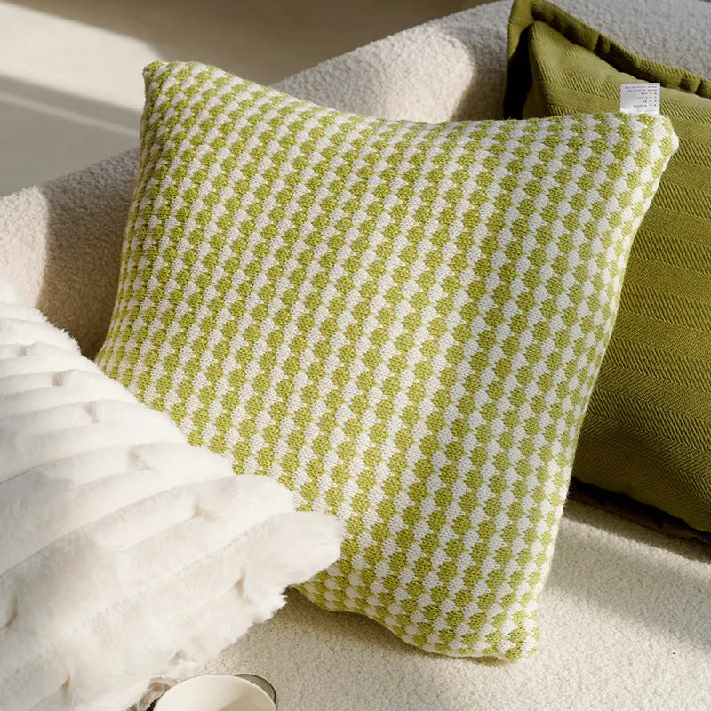 Green and white checkered pillow on a textured surface boho home decor, housewarming gift, embroidered pillow cover, flying bird cushion, animal pattern pillowcase, decorative throw pillow, Nordic cushion cover, luxury boho accent, sofa decor, nature-inspired pillow, canvas cushion case, textured home accessories