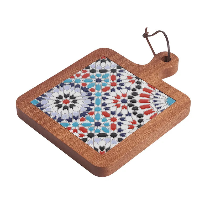 Decorative cutting board with geometric mosaic design on a white background