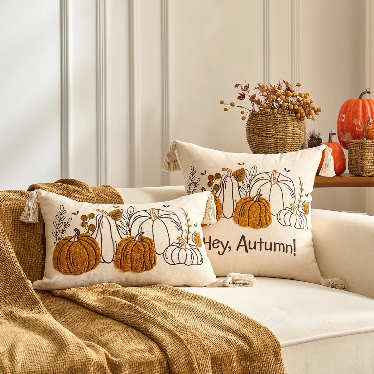Decorative pillows with pumpkin designs and 'Hey, Autumn!' text on a sofa with autumn-themed decor. Halloween and Thanksgiving decorative pillow cover For Fall