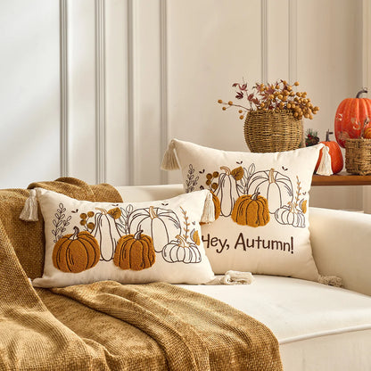 Decorative pillows with pumpkin designs and 'Hey, Autumn!' text on a sofa with autumn-themed decor. Halloween and Thanksgiving decorative pillow cover For Fall