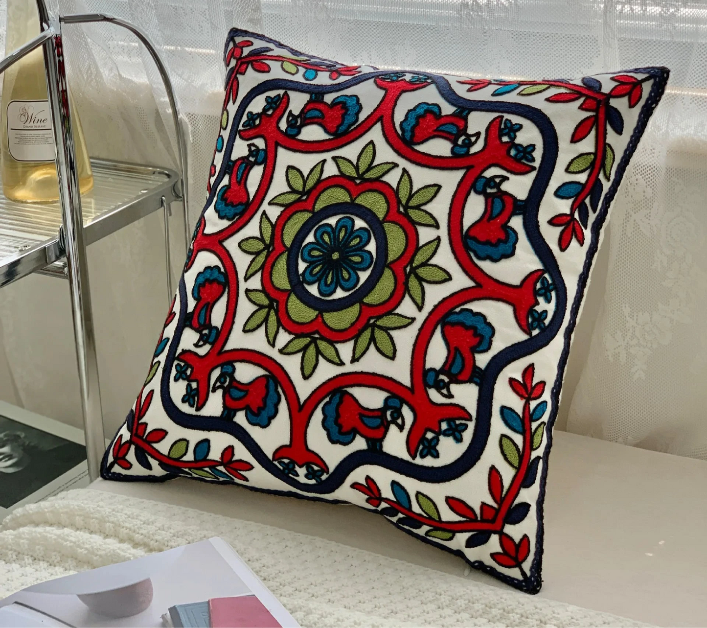 Decorative pillow with intricate patterns on a couch floral embroidery on linen cotton cushion cover – boho home decor accent