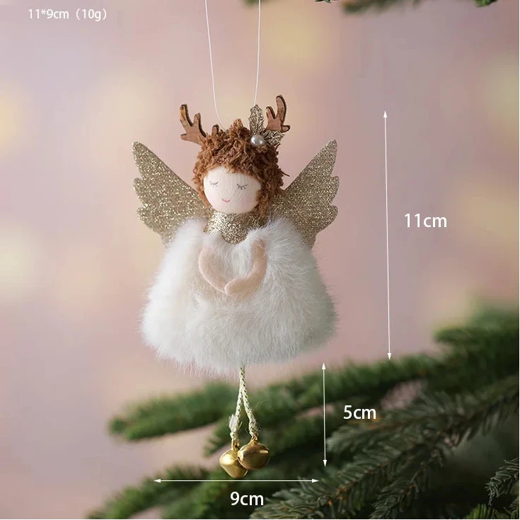Decorative angel ornament with antlers hanging on a tree branch, with measurements indicated.