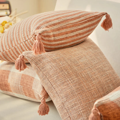 Orange linen tassels cushion cover styled on modern sofa, decorative boho throw pillow for living room, bed, or chair, perfect for cozy home vibes and housewarming gift ideas. Square and Rectangle.