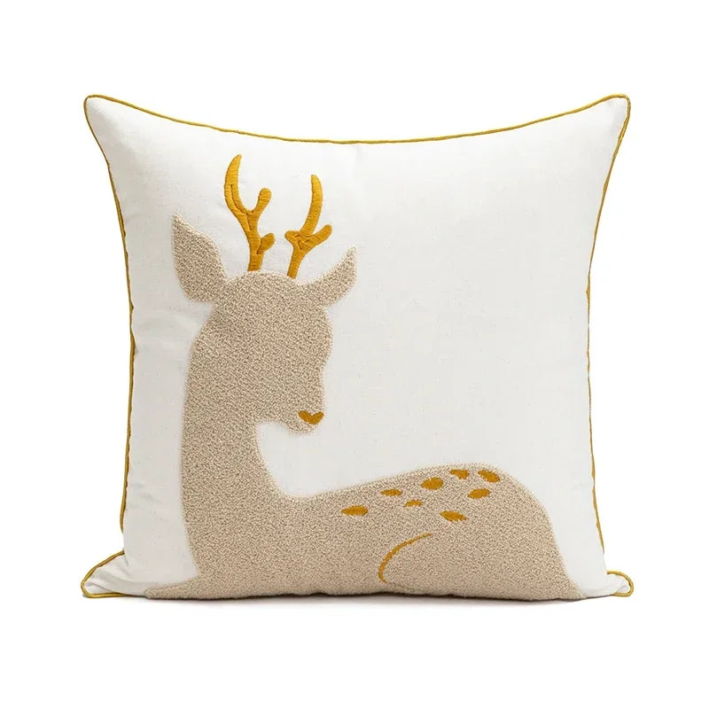 Decorative pillow with a deer design on a white background