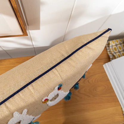 Decorative pillow with embroidered design on a wooden surface. Bohemian embroidered throw pillow cover with geometric design, cotton-blend cushion for sofa, bed, or modern home decor.