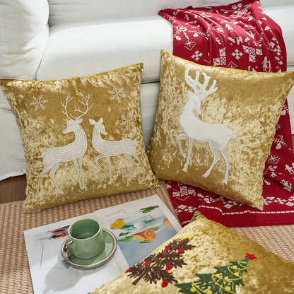 Gold velvet pillows with reindeer designs on a couch with a red blanket and magazine. Christmas embroidered pillow cover in gold, 18x18 inch festive cushion case for sofa, bed, or holiday home décor. Christmas Gift Ideas