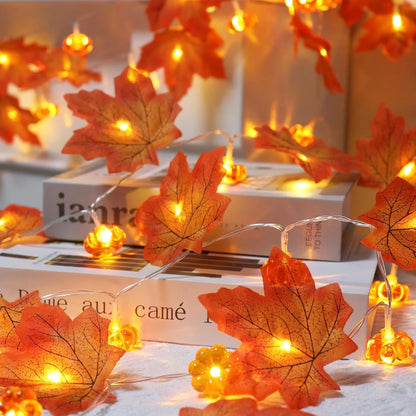 Decorative string lights with leaf design on a surface. fall leaf lights 