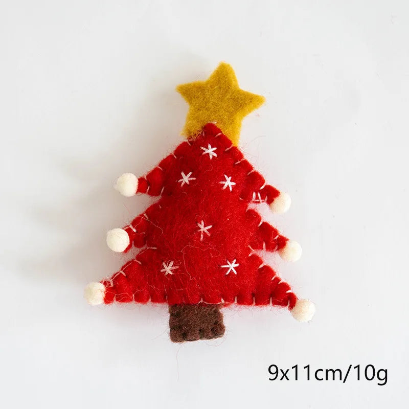 Red felt Christmas tree ornament with a yellow star on a white background