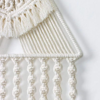 Close-up of a macrame wall hanging with intricate patterns and tassels on a light background. boho home decor, macrame wall hanging, triangle dream catcher, woven tapestry, handmade cotton wall decor, tassel wall hanging, bedroom door decor, housewarming gift, rustic bohemian art, boho apartment wall decor, neutral textile art