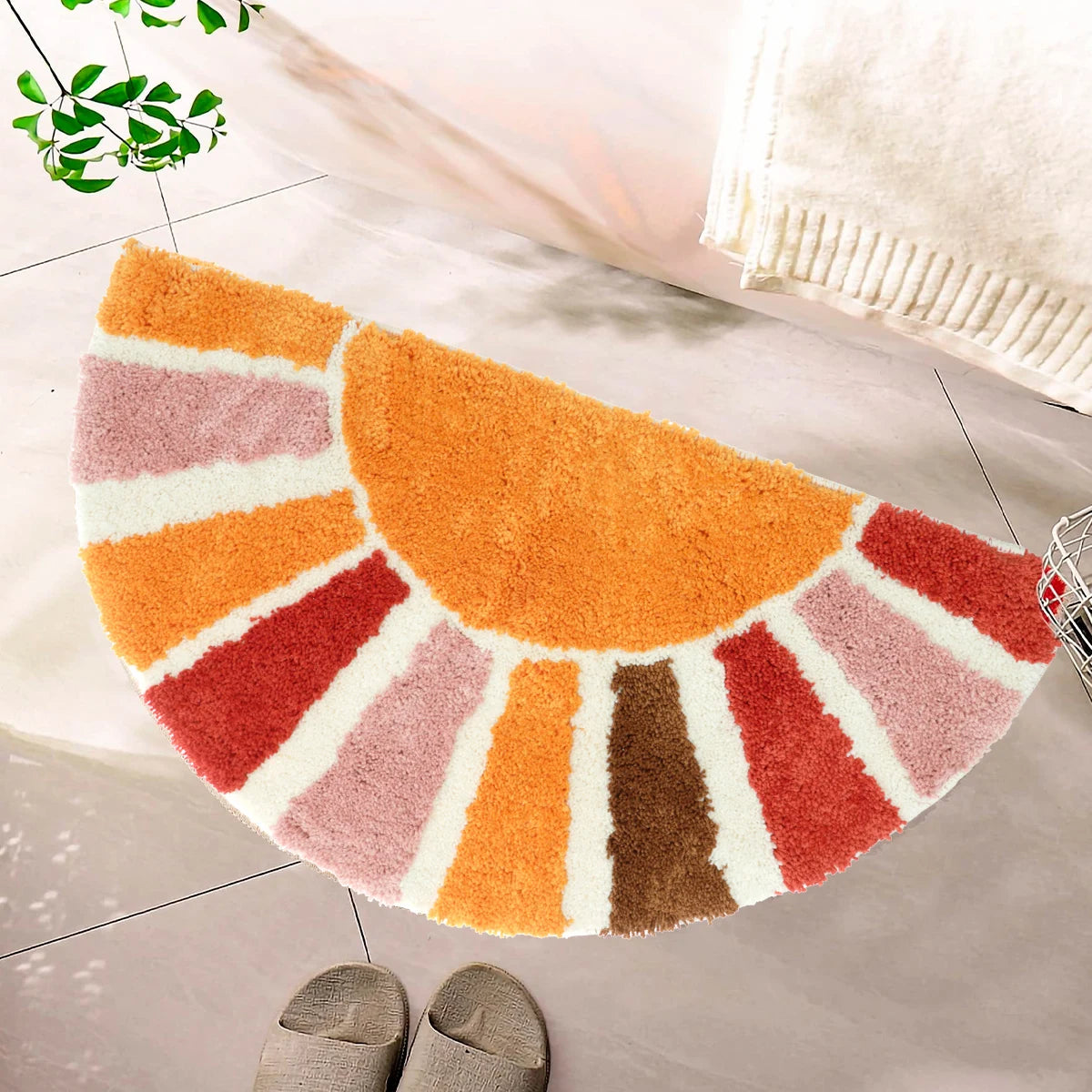 Colorful half-circle rug on a tiled floor with a plant and white basket in the background. boho home decor, sunflower door mat, half circle rug, plush entry mat, non-slip bath mat, boho floor mat, floral floor rug, bathroom rug, farmhouse decor, cozy home gift, housewarming gift, living room mat, pastel home accents, cute doormat
