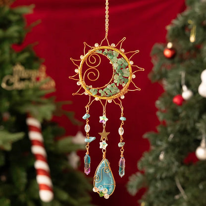 Decorative sun-shaped ornament with beads and stars hanging against a Christmas tree background. boho home decor, crystal wind chime, sun catcher for windows, moon prism chime, agate stone hanging, garden art decor, patio hanging decoration, boho housewarming gift, spiritual gift, crystal suncatcher, balcony decor, meditation decor, handmade crystal chime
