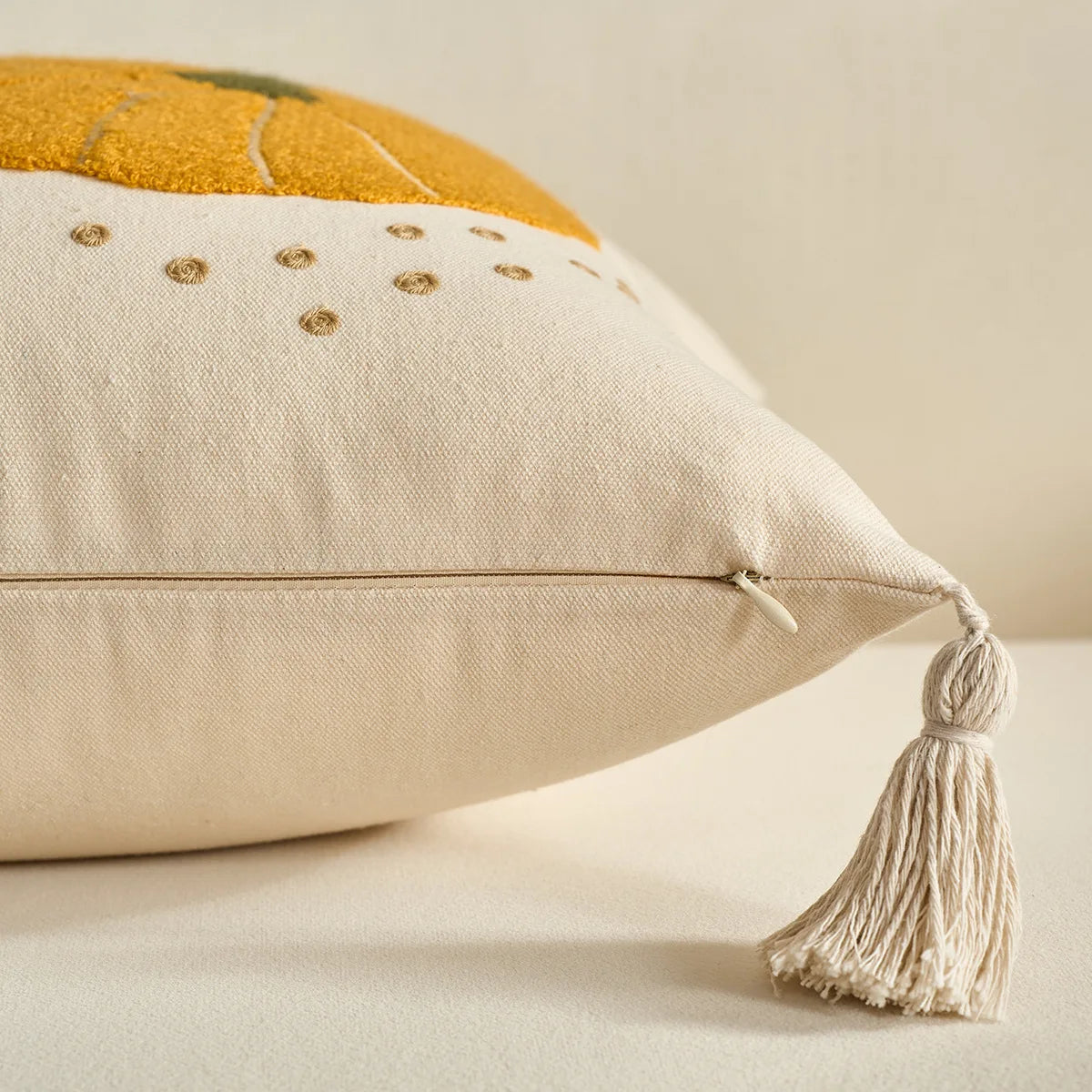 Decorative pillow with tassel on a neutral background. Halloween and Thanksgiving decorative pillow cover For Fall