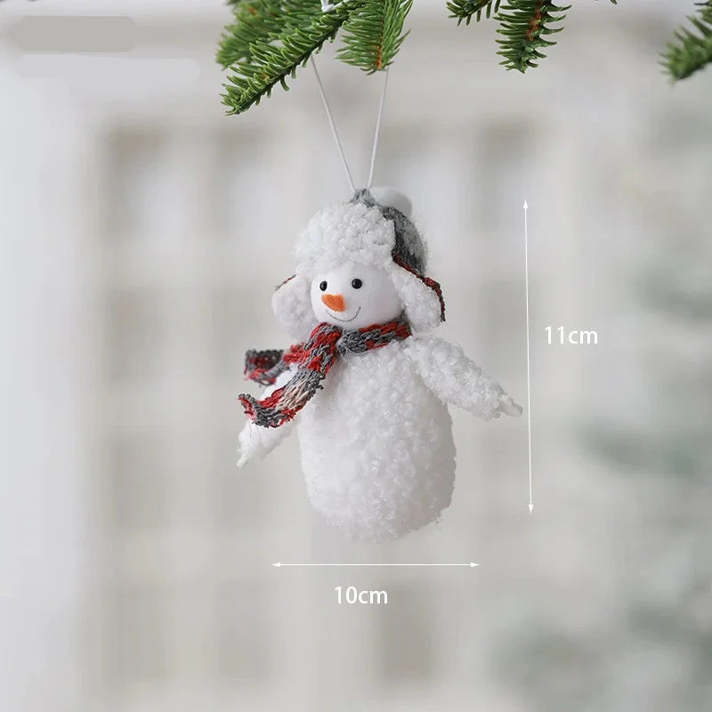 Snowman ornament with dimensions labeled, hanging from a branch.