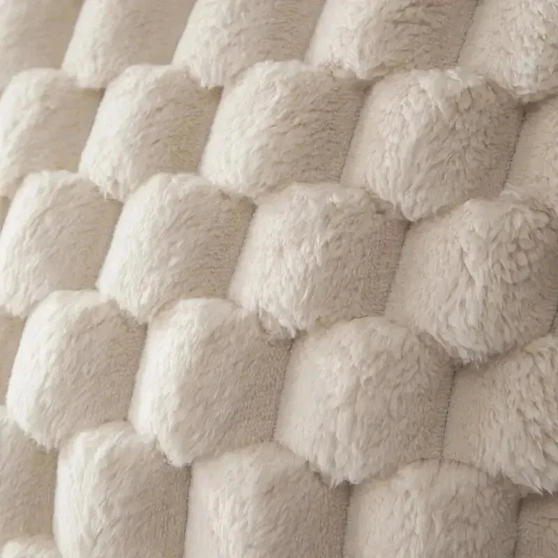 Close-up of textured beige fabric with a basketweave pattern