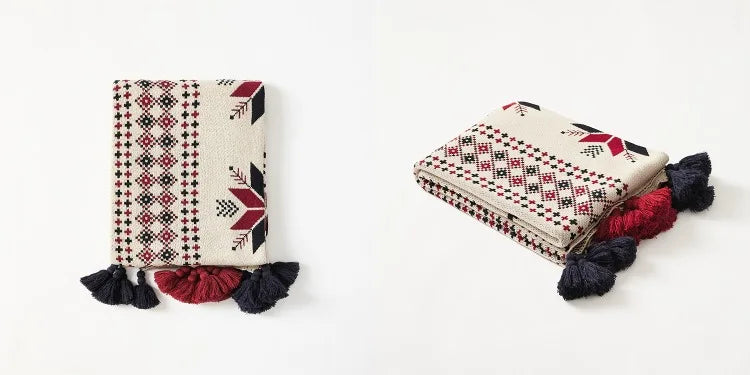Two patterned pouches with tassels on a white background