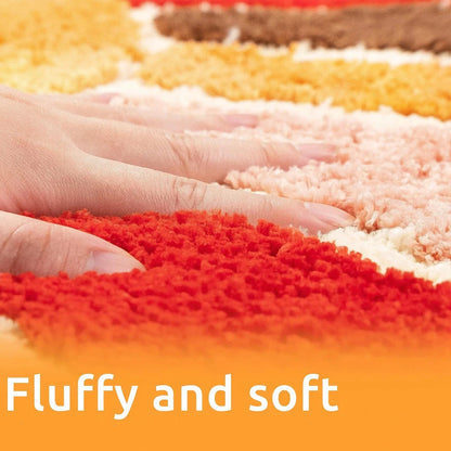 Close-up of colorful textured fabric with a hand touching it, and text 'Fluffy and soft' at the bottom. boho home decor, sunflower door mat, half circle rug, plush entry mat, non-slip bath mat, boho floor mat, floral floor rug, bathroom rug, farmhouse decor, cozy home gift, housewarming gift, living room mat, pastel home accents, cute doormat