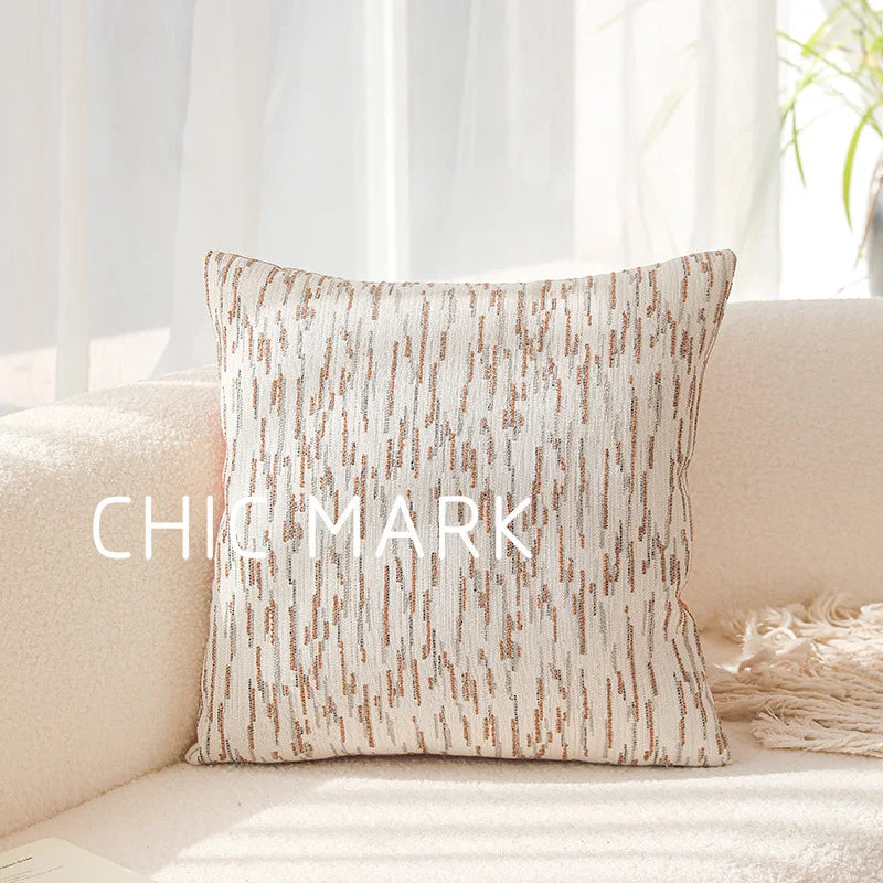 Textured pillow on a beige sofa with 'Chic Mark' branding.Modern yarn-dyed throw pillow cover, luxury textured decorative cushion for sofa, bed, or window seating in soft neutral tones.