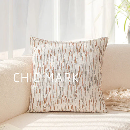 Textured pillow on a beige sofa with 'Chic Mark' branding.Modern yarn-dyed throw pillow cover, luxury textured decorative cushion for sofa, bed, or window seating in soft neutral tones.
