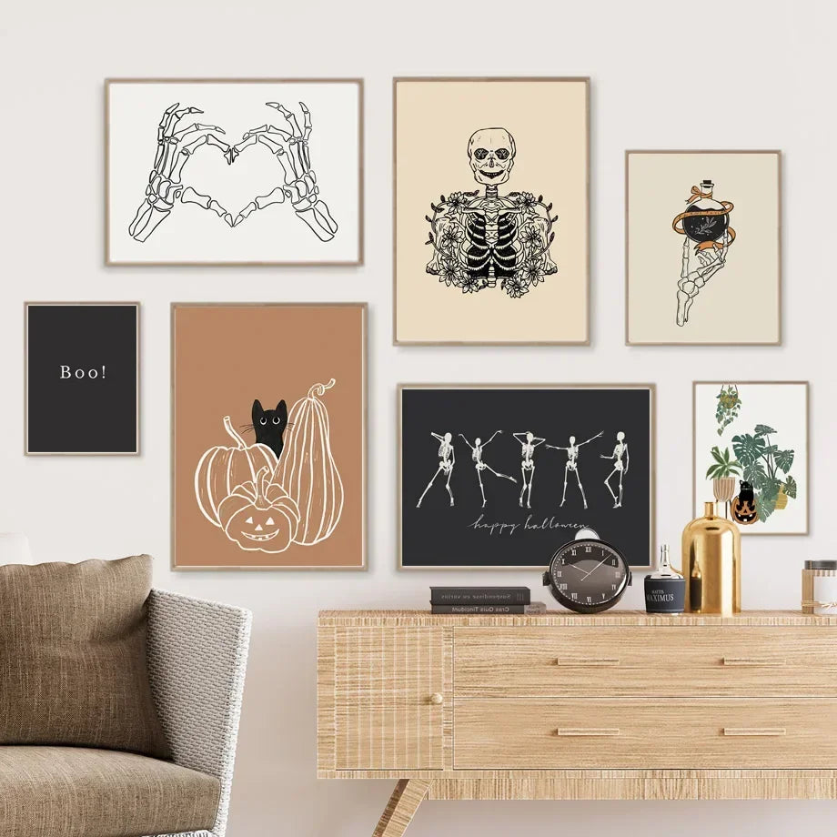Halloween-themed wall art on a wall above a wooden console table.