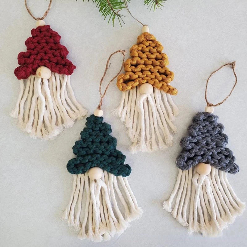 Set of five knitted gnome ornaments in different colors on a light background
